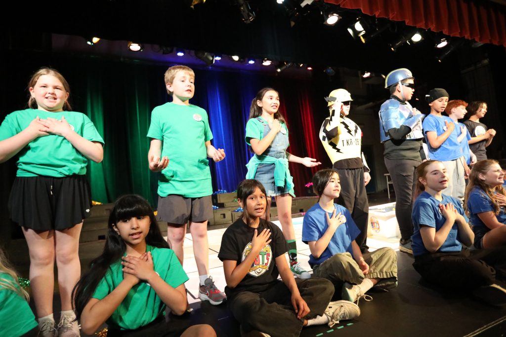 5th graders on stage at Bancroft School in rehearsal f or the 5th grade musical.