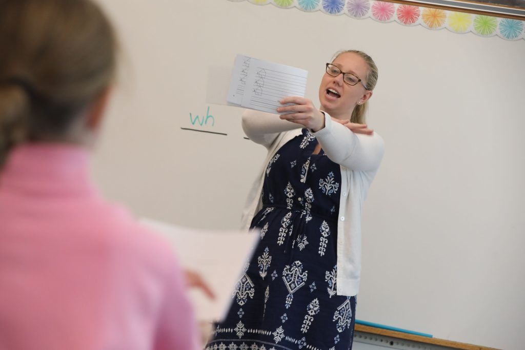 Teacher in front of class.