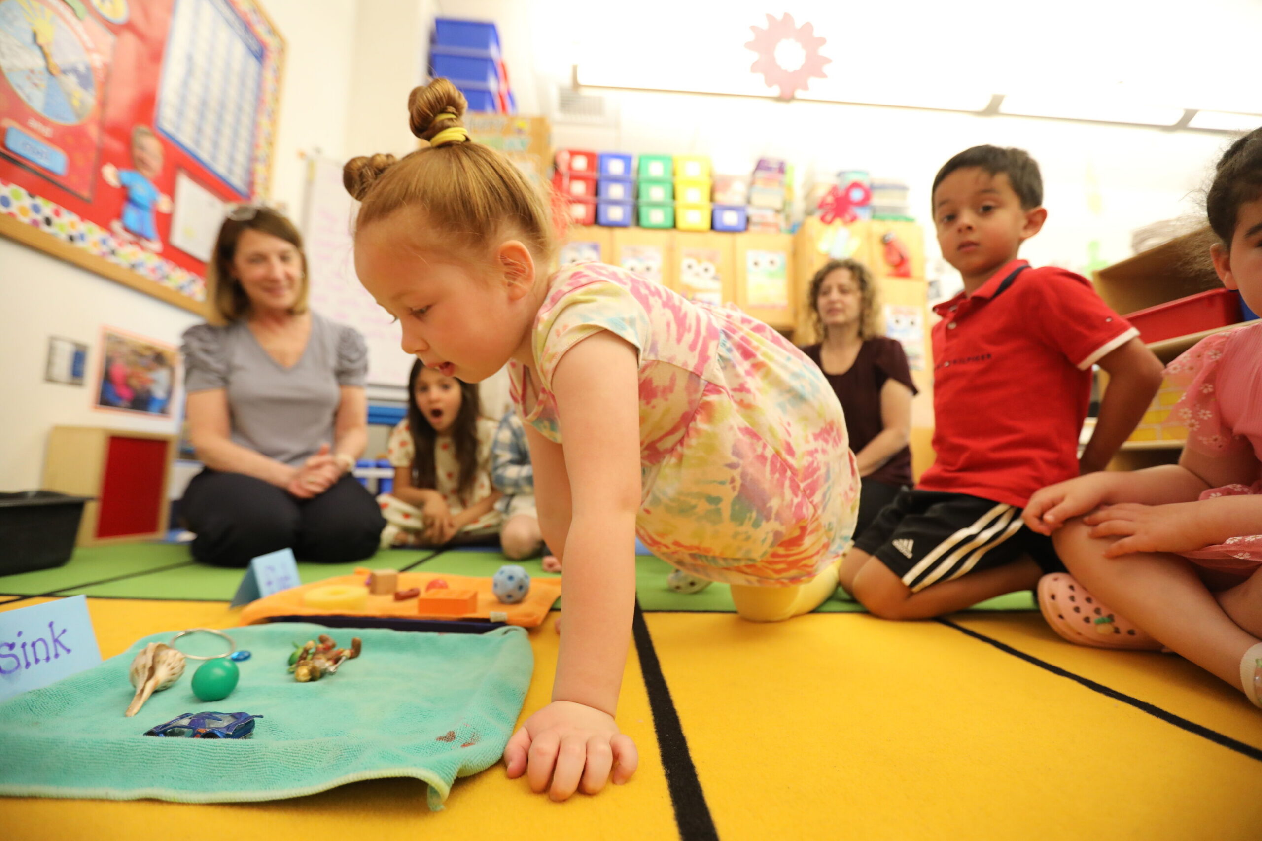 PreK student in circle time.