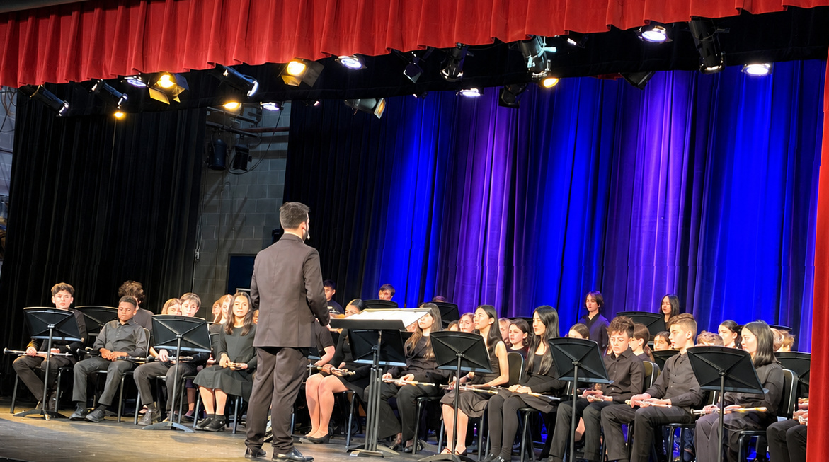 Lower School and Middle School band members on stage and ready to play.