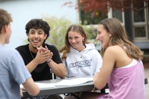 Bancroft School in Worcester, MA sitting outside laughing.